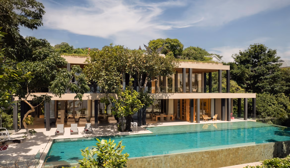 Exterior view of a 5-bedroom villa in Kamala. The multi-story property features a terraced facade and is located within a gated community.