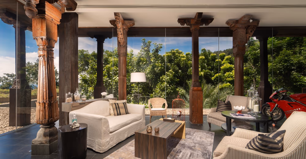 A spacious living area with modern decor and large windows offering ocean views.