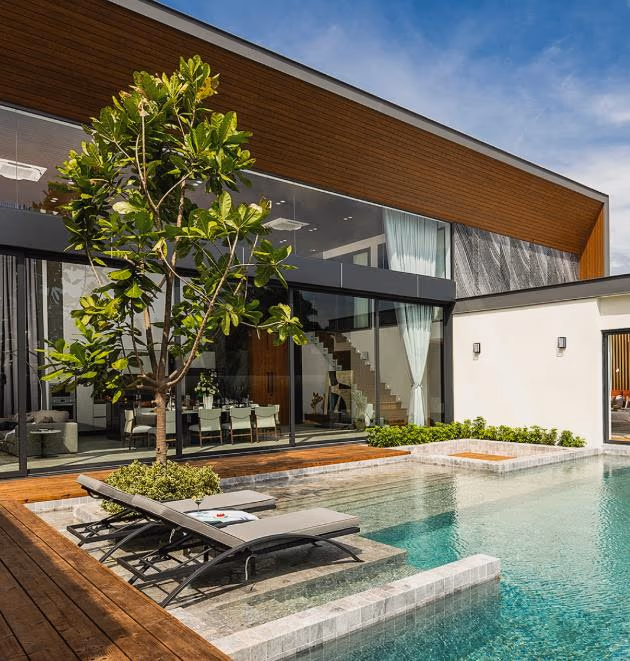 A modern minimalist villa with a private pool, located near Bang Tao Beach.