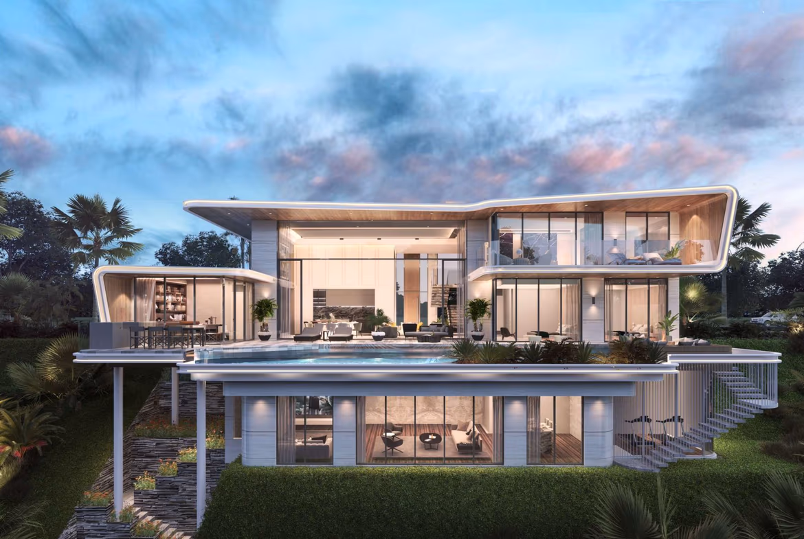 A modern villa in Manick with a private pool, surrounded by natural landscaping and mountains in the background.