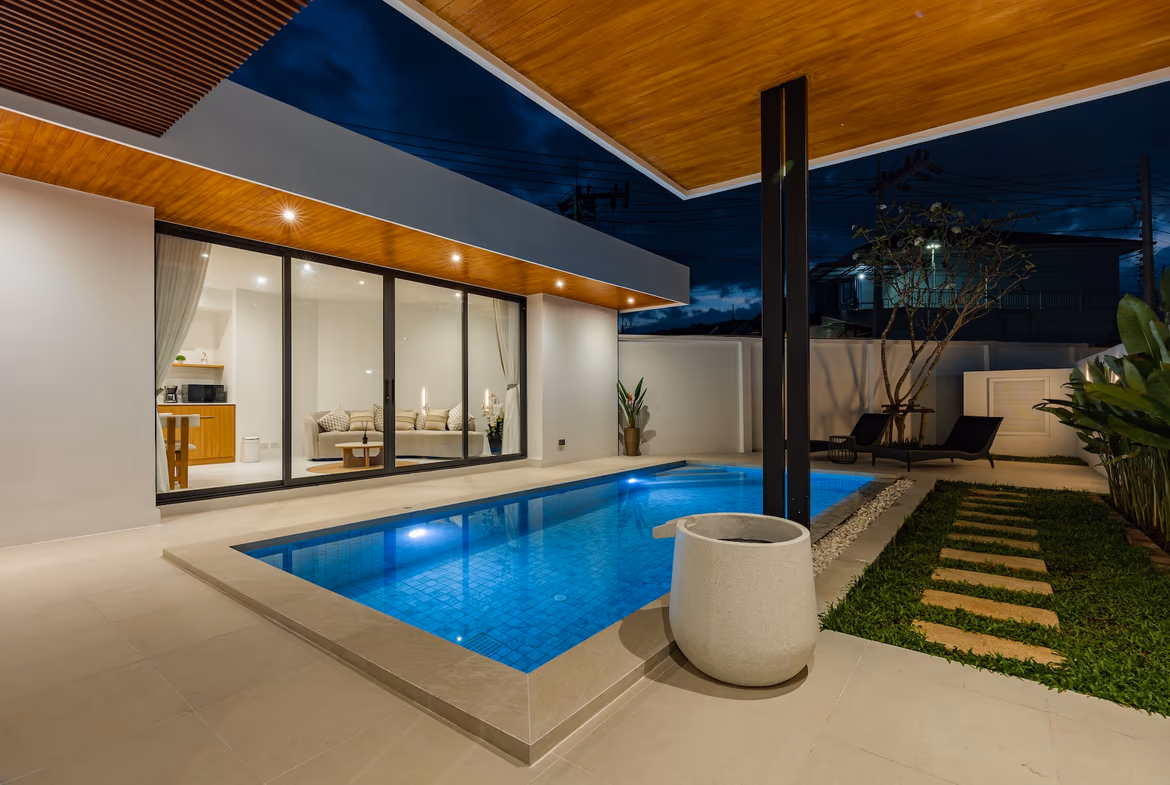 A modern three-bedroom pool villa in Cherngtalay, Thailand. The villa features a private swimming pool and a well-maintained outdoor area.