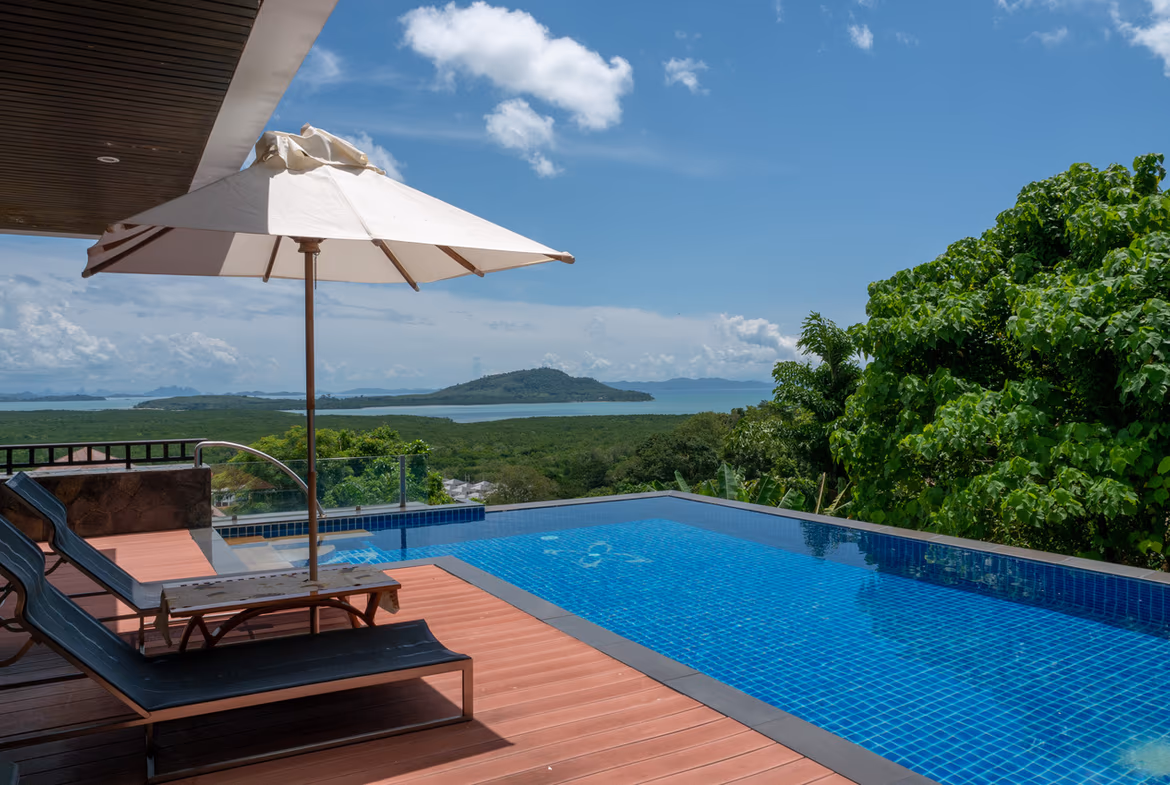 Exterior of a 5-bedroom villa in Cherngtalay, featuring a large infinity pool on the upper deck.