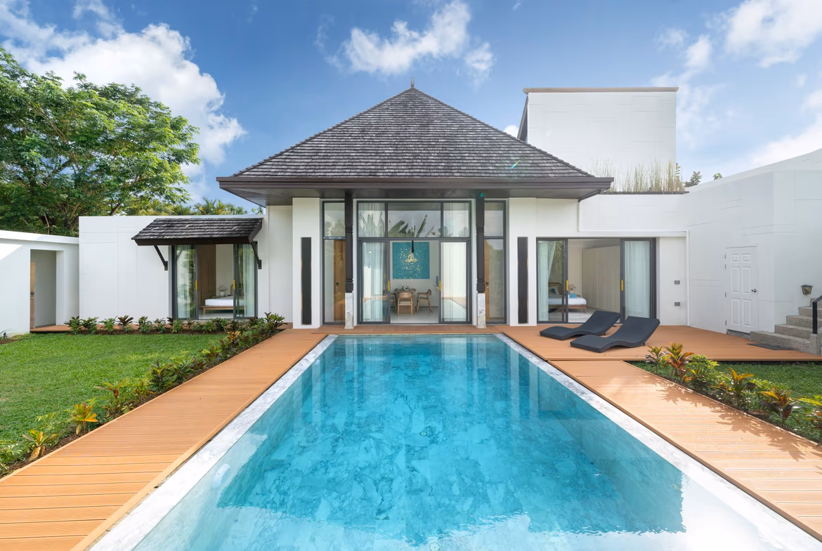 This refined three-bedroom villa in Cherngtalay features a private pool and a modern architectural design.