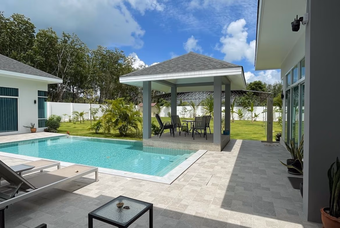 Exterior view of a 4-bedroom villa in Cherngtalay, featuring a private pool.