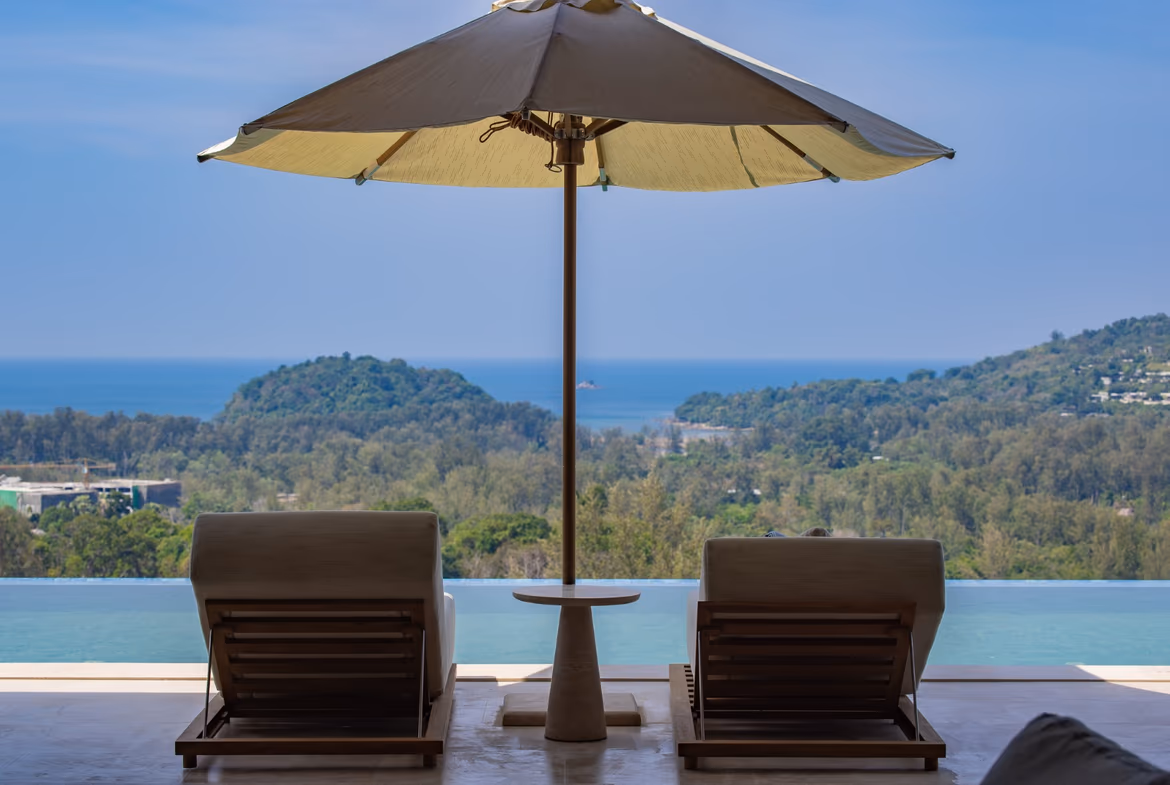 This villa offers a distant sea view from an outdoor living area.