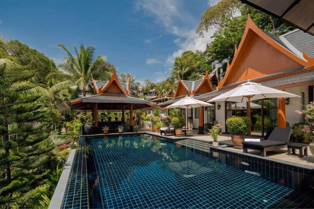 A 5-bedroom villa in Cherngtalay, featuring distinct Thai-style architecture and a seaview from its elevated position.
