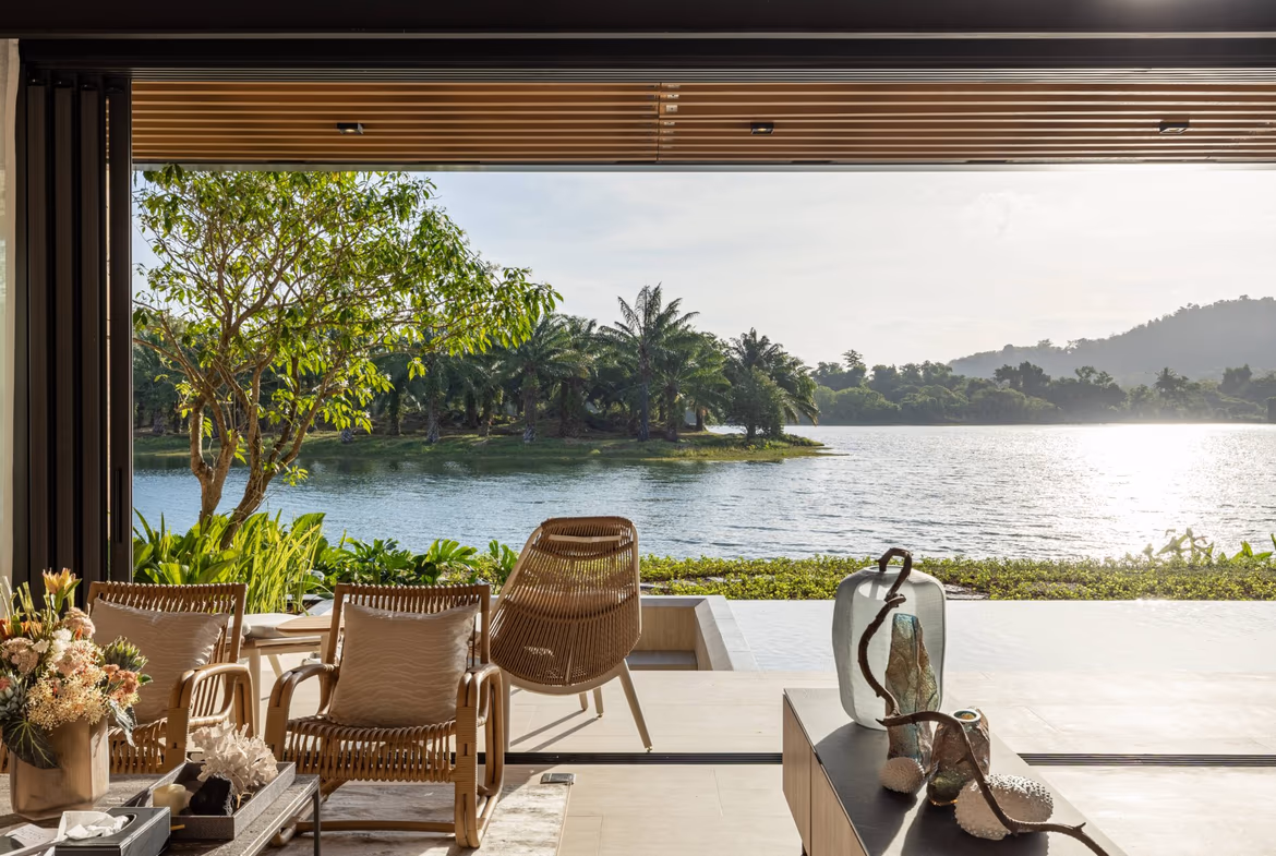 This is an exterior shot of a three-bedroom villa in Cherngtalay, featuring a private swimming pool.