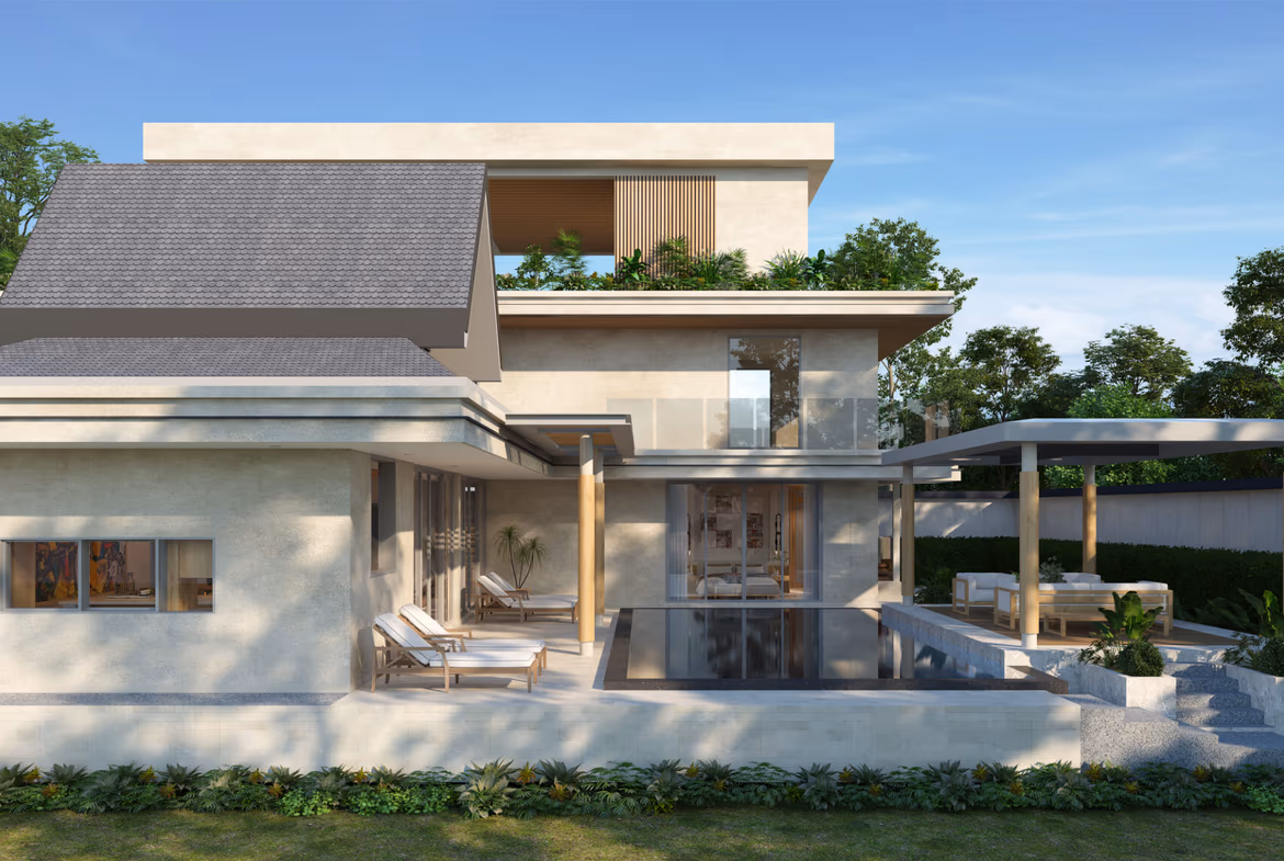 A modern open-plan living area with a sofa and access to an outdoor patio with sea views.