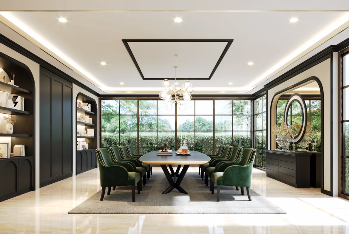 Luxurious dining room with a long oval table, green upholstered chairs, black cabinetry, and large windows letting in daylight.