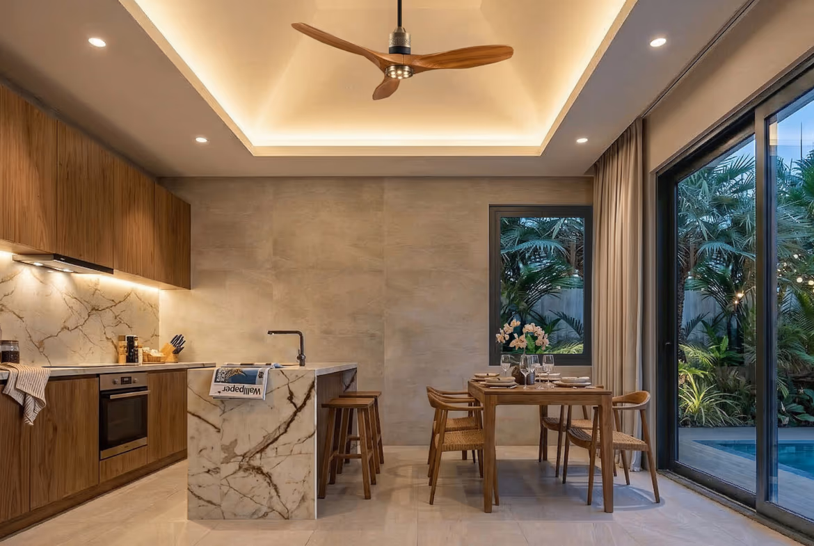 A spacious living room with large windows overlooking a lush tropical garden.