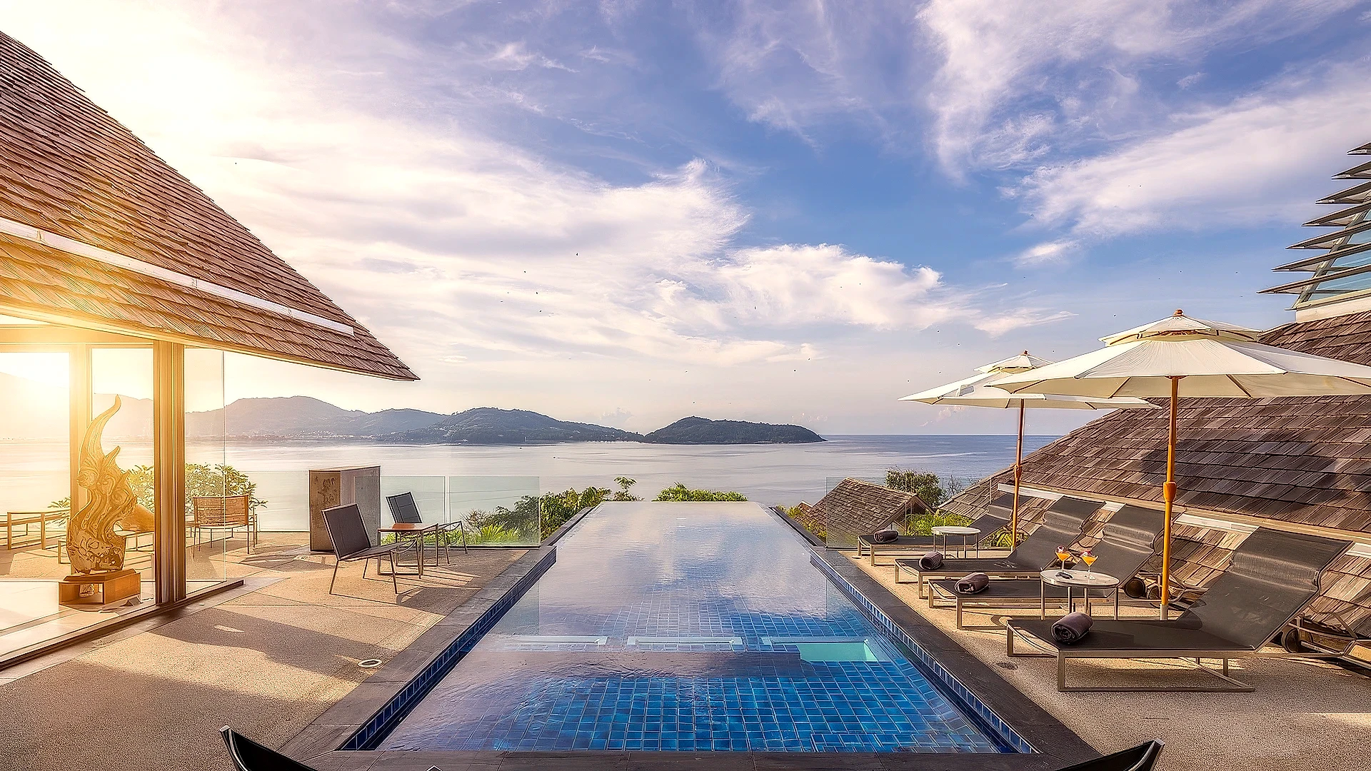 A luxurious bathroom with a large bathtub and ocean views.